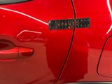 a sticker on the door of a red car