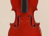 a red violin with a black bow hanging from it ' s back