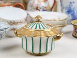 many different types of porcelain bowls and bowls on the table