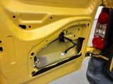 a close up of the door of a yellow car