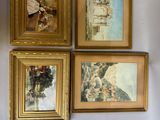 trois tableaux encadrés représentant une femme et un enfant, accrochés au mur