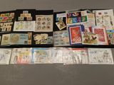many different types of stamps on the table