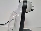a black and white coffee maker on a white table