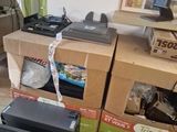 many boxes of electronic equipment sitting on the floor