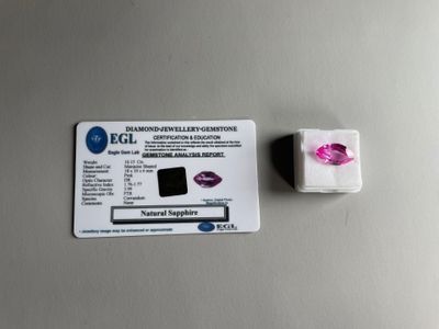 an image of a purple diamond and a white diamond on a table