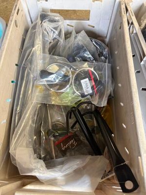 a box full of assorted items sitting on the floor