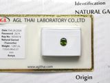 a close up of a green tourmaline stone on a card