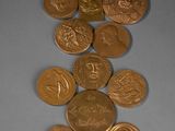 a lot of coins that are on the table
