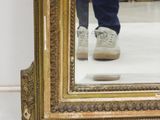 a person standing in front of a mirror in a room