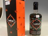 a bottle of alcohol next to a box of cigarettes