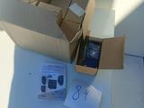 a box with a cell phone inside of it on a table