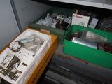 two bins of assorted items on the shelf