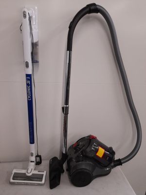 a vacuum that is sitting on a table next to a vacuum