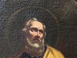 painting of a man in a yellow robe holding a flower
