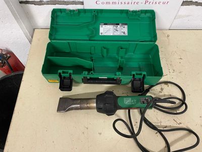 an image of a green tool box on a table