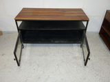 a small table with a shelf on it in a room