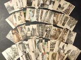 a black and white photo of a bunch of old postcards