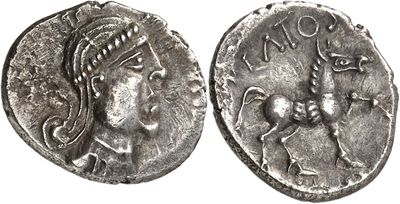 a silver coin with an image of a woman on it