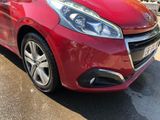 a red car that is parked in the parking lot