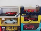 several toy cars are stacked on top of each other in boxes