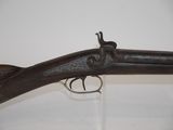 an old gun that is on display in a museum