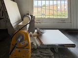 an image of a bench in a room with a window