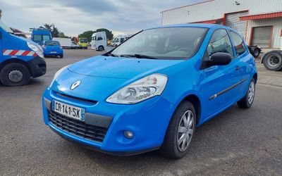 a blue car that is parked in a parking lot