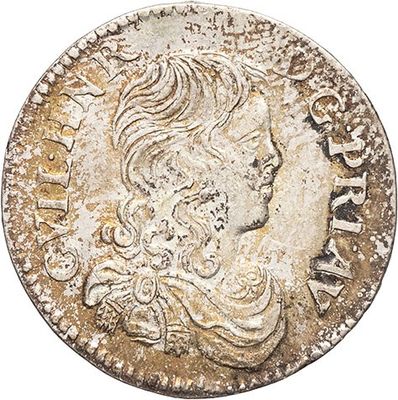 a silver coin with a woman ' s head on it