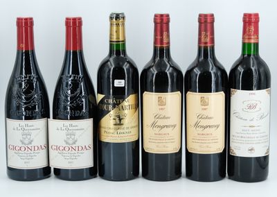 six bottles of wine are lined up in a row on a table
