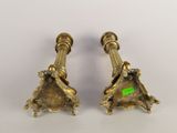 pair of antique brass candlesticks with green stickers