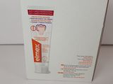 a box with a tube of toothpaste inside of it