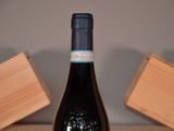 a bottle of wine that is sitting on a table