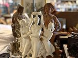 many figurines on a table in a store