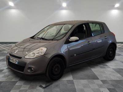 the small car is parked on the checkered floor in the garage