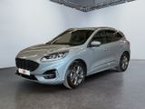 a silver ford kuga parked in a large room