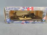 toy car in a box on a table with a canadian flag