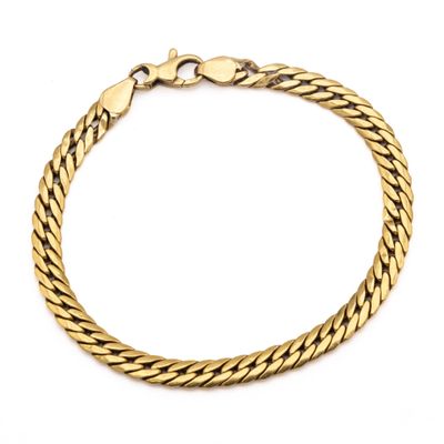 a gold bracelet with a braid design on a white background