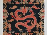 an oriental rug with a red dragon on a black background
