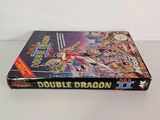 a book with a picture of a dragon on it sitting on a table