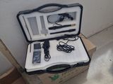 a suitcase that is sitting on the floor with a cell phone in it