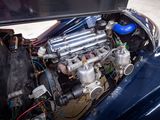 a close up of a small engine in a blue car