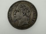 a silver coin with a woman ' s head on it