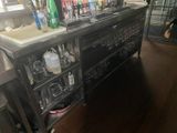 a bar with a lot of bottles on top of it