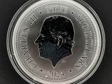 Gros plan sur une pièce de monnaie portant le visage d'un homme