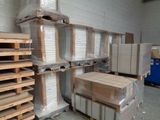 boxes and pallets are stacked on pallets in a warehouse