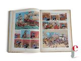 an open book with a picture of a pirate ship in it