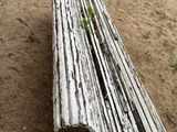 a wooden bench sitting in the sand on the beach
