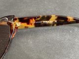 a close up of a pair of sunglasses on a table
