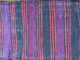 a purple and red striped cloth on a table