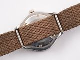 a close up of a wrist watch with a brown strap